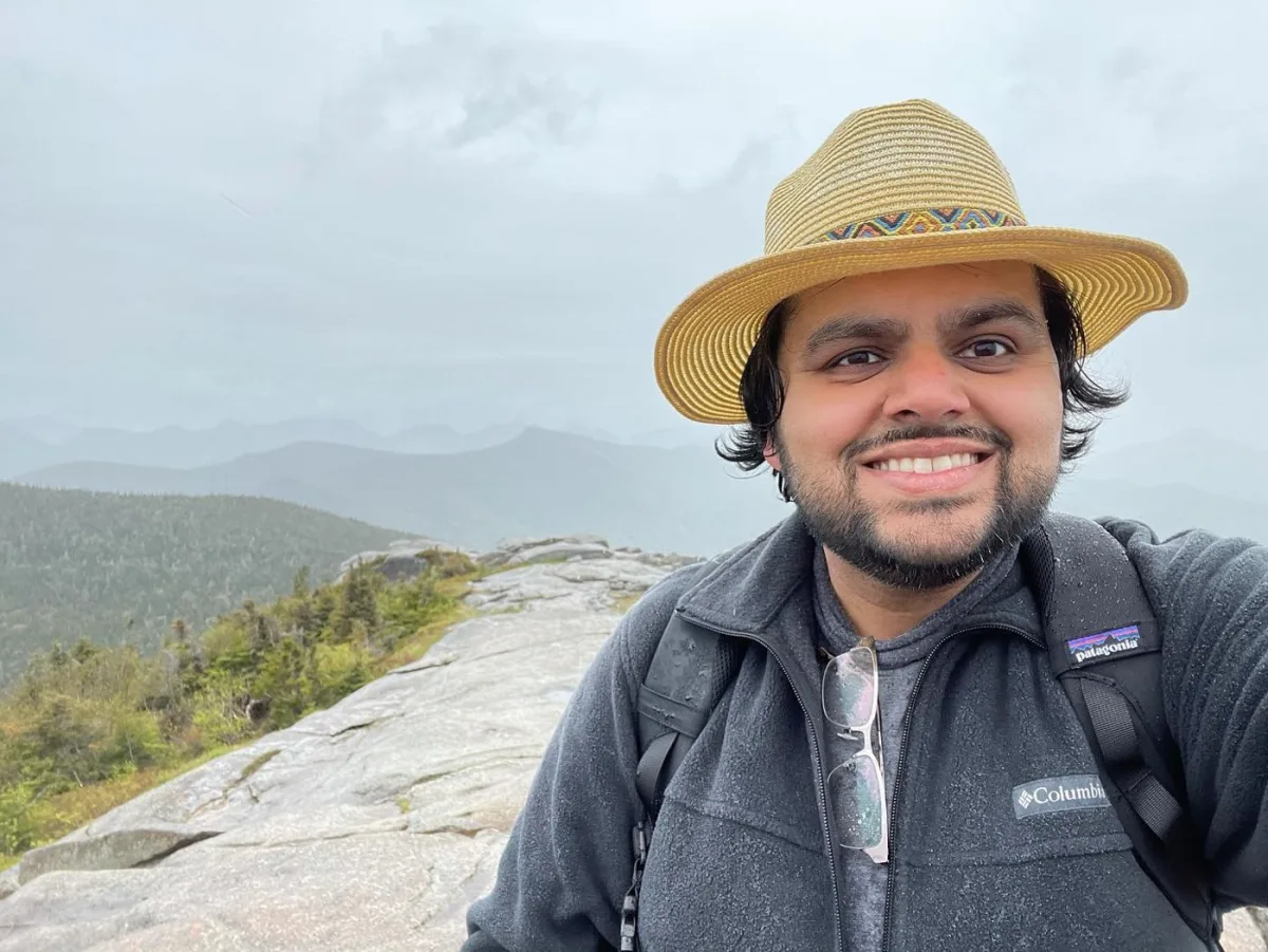 At the summit, still wearing the sombrero.