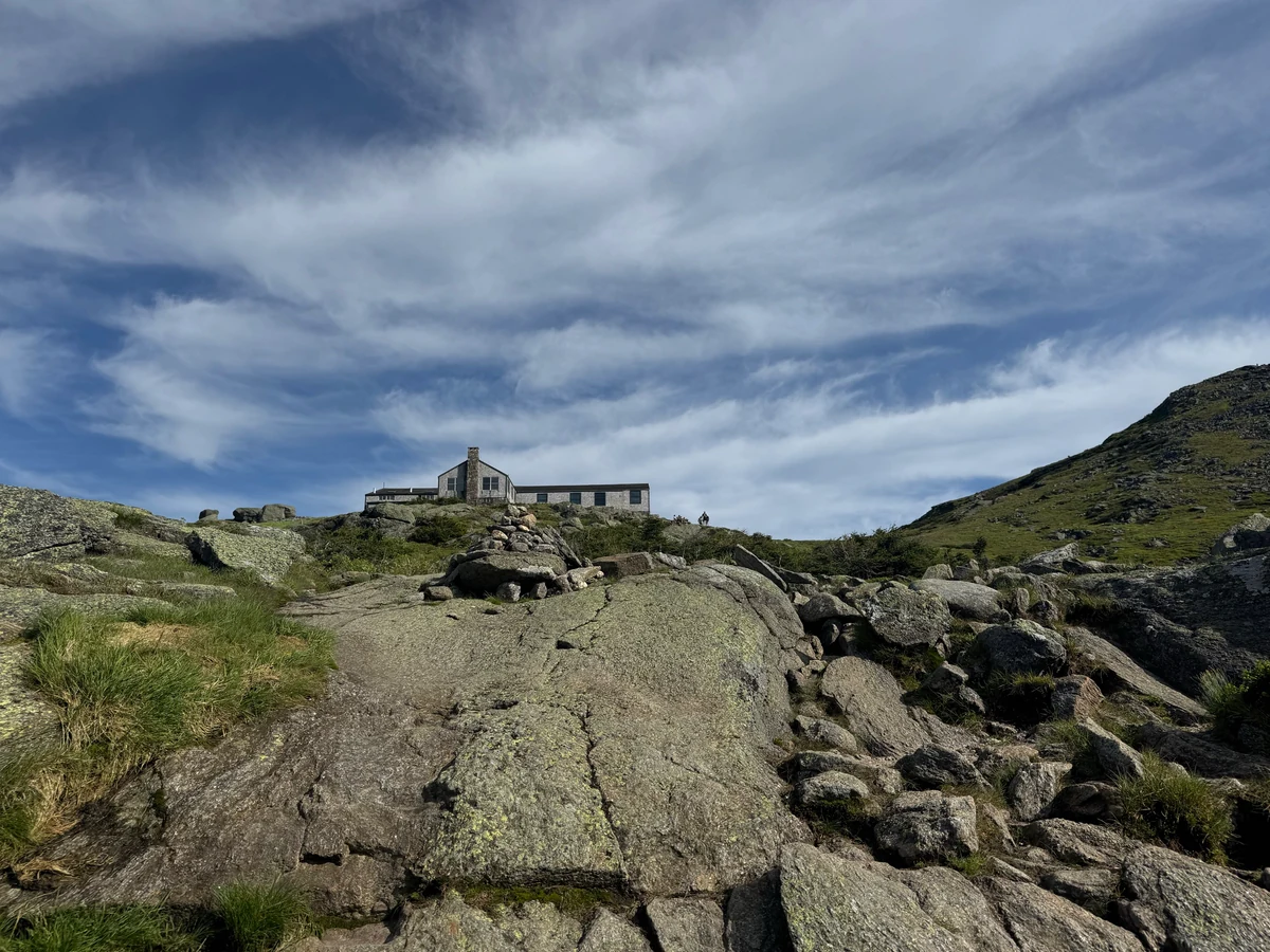 Lakes of the Clouds Hut above the rocky trail